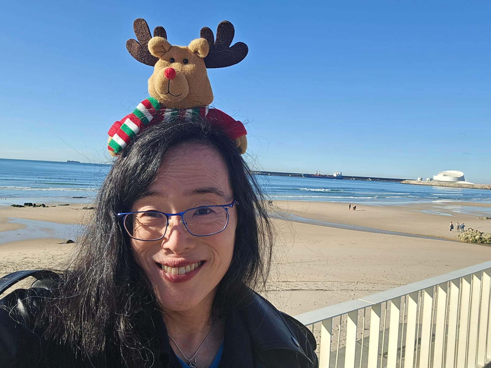 Playing french horn on the beach